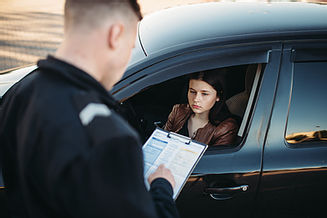 Policeman in uniform writes fine to fema